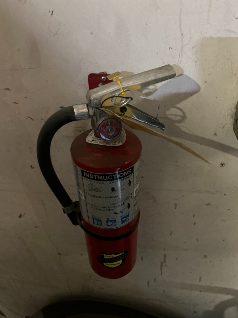 Green NAFED compliance tag applied by Fire Safety Industries in Albuquerque NM